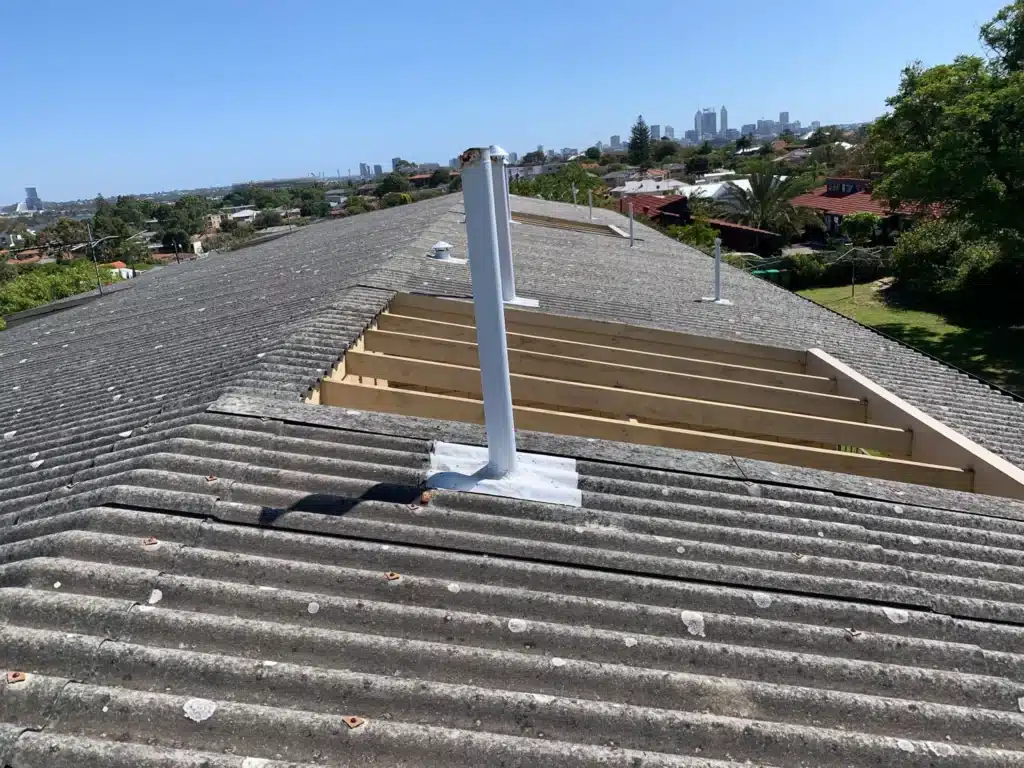 Asbestos roof sheeting on residential property in Perth with section removed for safe asbestos removal and replacement work