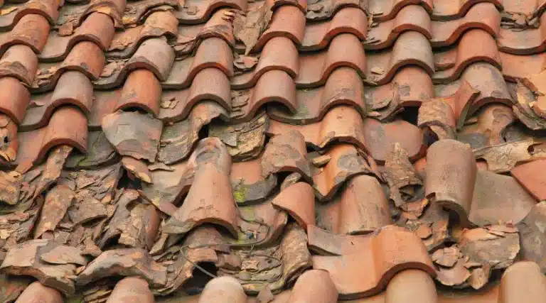 severely damaged tile roof with cracked and broken tiles Perth home