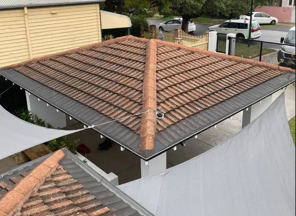 Tiled roof with new gutter replacement installed on Perth home showing clean edges and proper drainage
