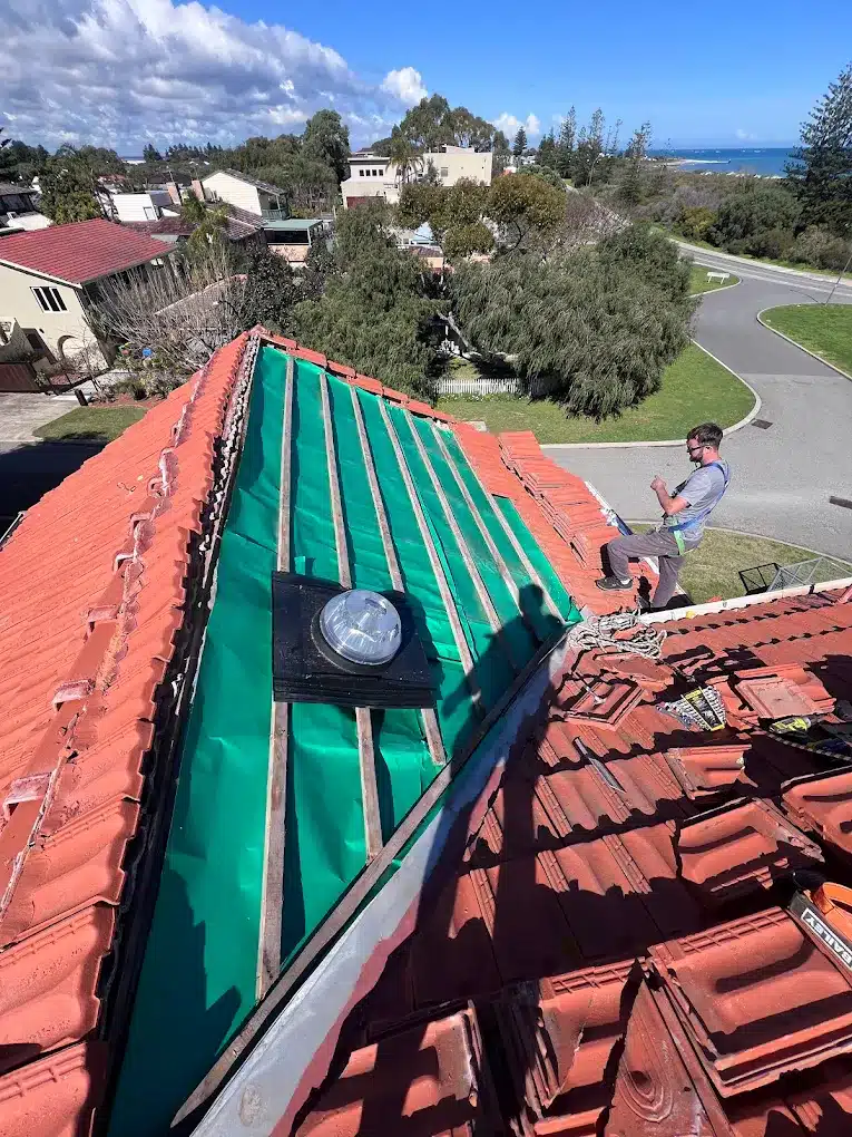 Roofing Perth tile roof repair on coastal residential property with safety setup