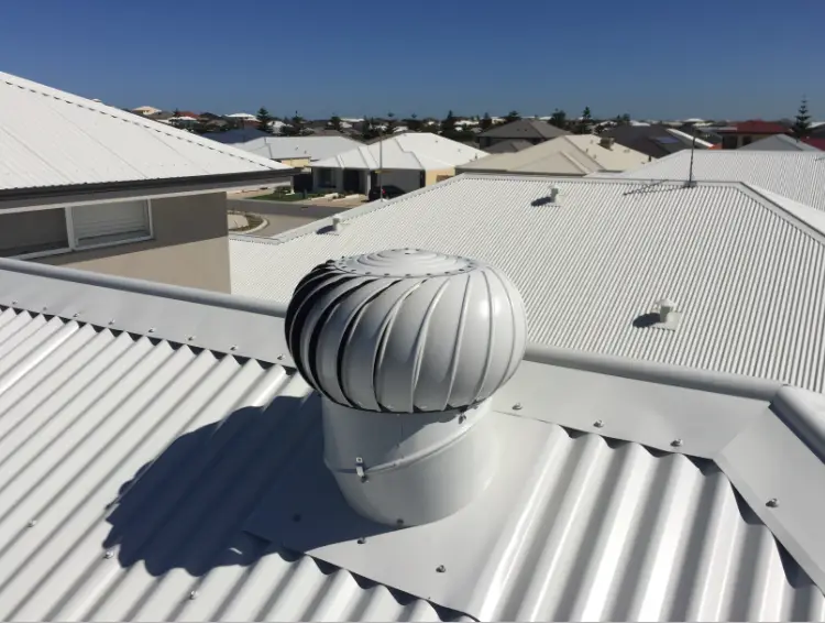 Insulmate roof ventilation system with a whirlybird installed on a metal roof.