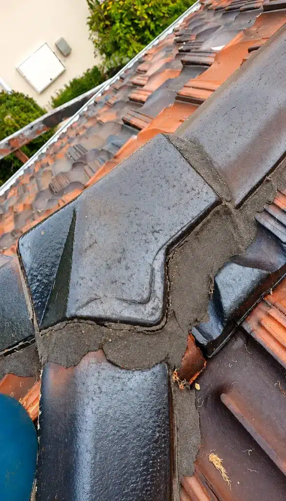 Cracked roof pointing around ridge tiles requiring repair in City Beach