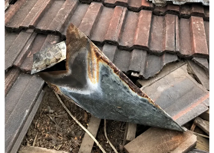 Damaged rusted gutter removed during gutter replacement project in Perth