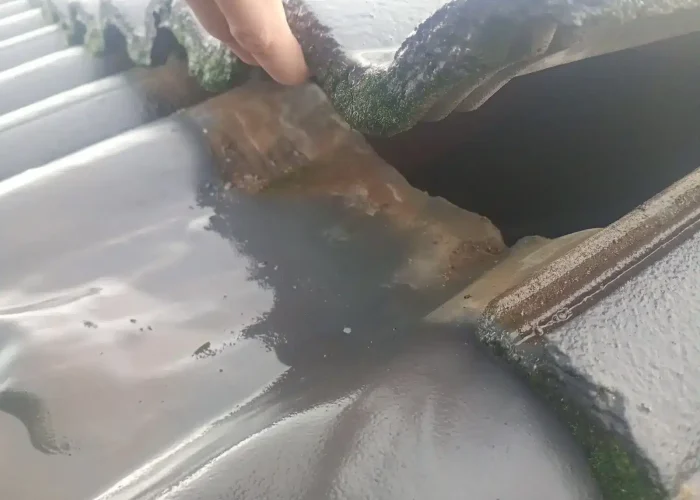 Water ingress identified during a roof leak inspection in a tiled roof valley.